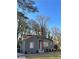 Gray house with red door, surrounded by trees at 678 Charlotte Nw Pl, Atlanta, GA 30318