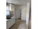 Kitchen with white cabinets and tile flooring at 678 Charlotte Nw Pl, Atlanta, GA 30318