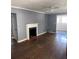 Living room with hardwood floors and fireplace at 678 Charlotte Nw Pl, Atlanta, GA 30318