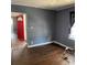 Living room with hardwood floors and red front door at 678 Charlotte Nw Pl, Atlanta, GA 30318