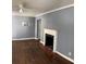 Living room with hardwood floors and fireplace at 678 Charlotte Nw Pl, Atlanta, GA 30318