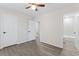 Spacious bedroom with gray floors and access to bathroom at 6093 Camden Forrest Ct, Riverdale, GA 30296