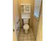 Bathroom with tiled floor, toilet, grab bars, and window at 143 Tracy Ln, Mcdonough, GA 30253