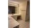Bright bathroom with double sink vanity, tiled floor, and shower stall at 143 Tracy Ln, Mcdonough, GA 30253