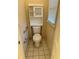 Bathroom with tiled floor, toilet, grab bars, and window at 143 Tracy Ln, Mcdonough, GA 30253
