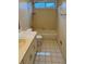 This is a view of the neutral toned bathroom with classic vanity and shower-tub combination at 143 Tracy Ln, Mcdonough, GA 30253