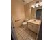 Neutral half bathroom featuring a toilet, vanity, and handrails at 143 Tracy Ln, Mcdonough, GA 30253