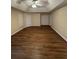 Spacious bedroom with hardwood floors, windows and ceiling fan at 143 Tracy Ln, Mcdonough, GA 30253