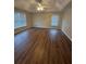 This primary bedroom is spacious, with wood floors and plenty of natural light at 143 Tracy Ln, Mcdonough, GA 30253