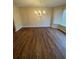 An elegant chandelier hangs over the dining room with a view of backyard at 143 Tracy Ln, Mcdonough, GA 30253