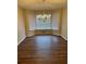 An elegant chandelier hangs over the dining room with a great bay window at 143 Tracy Ln, Mcdonough, GA 30253