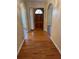 Inviting foyer features gleaming hardwood floors, a wooden front door, and attractive archways at 143 Tracy Ln, Mcdonough, GA 30253