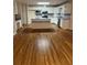 Bright kitchen featuring white cabinetry, hardwood floors, and a center island, perfect for cooking at 143 Tracy Ln, Mcdonough, GA 30253