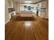 Bright kitchen featuring white cabinetry, hardwood floors, and a center island, perfect for cooking at 143 Tracy Ln, Mcdonough, GA 30253