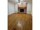 A warm, inviting living room features a fireplace, wood floors, and ample natural light at 143 Tracy Ln, Mcdonough, GA 30253