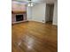 A warm, inviting living room features a fireplace, wood floors, and ample natural light at 143 Tracy Ln, Mcdonough, GA 30253