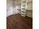 Walk-in closet with shelves and hardwood floors at 143 Tracy Ln, Mcdonough, GA 30253