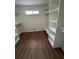 Walk-in closet with shelves and hardwood floors at 143 Tracy Ln, Mcdonough, GA 30253