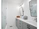 Modern bathroom with double vanity, large mirrors, and walk-in shower at 200 Chestnut Cir, Atlanta, GA 30342