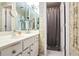Bathroom with single vanity, shower, and updated fixtures at 3805 Dogwood Farm Rd, Decatur, GA 30034