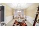 Elegant dining room features a chandelier and decorative wall trim at 3805 Dogwood Farm Rd, Decatur, GA 30034