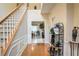 Two-story foyer with hardwood floors and a view of the kitchen at 3805 Dogwood Farm Rd, Decatur, GA 30034
