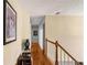 Upstairs hallway with hardwood floors and a wooden railing at 3805 Dogwood Farm Rd, Decatur, GA 30034