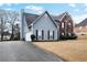 Two-story house with driveway and landscaping at 3805 Dogwood Farm Rd, Decatur, GA 30034