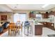 Kitchen with dark wood cabinets, tile flooring, and breakfast bar at 3805 Dogwood Farm Rd, Decatur, GA 30034