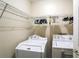 Convenient laundry room with washer, dryer, and shelving at 3805 Dogwood Farm Rd, Decatur, GA 30034