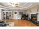Spacious living room with hardwood floors, fireplace, and built-in shelving at 3805 Dogwood Farm Rd, Decatur, GA 30034