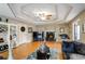 Living room with hardwood floors, fireplace, and a large TV at 3805 Dogwood Farm Rd, Decatur, GA 30034