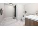 Basement bathroom with toilet and marble flooring at 930 White St, Atlanta, GA 30310