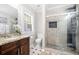 Updated bathroom with granite vanity, walk-in shower, and window at 930 White St, Atlanta, GA 30310