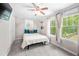 Bedroom with a queen bed, ceiling fan, and backyard view at 930 White St, Atlanta, GA 30310