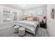 King bedroom with two ottomans and plenty of natural light at 930 White St, Atlanta, GA 30310