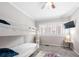 Bedroom with a bunk bed, ceiling fan, and TV at 930 White St, Atlanta, GA 30310