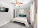 Bedroom with a queen bed, ceiling fan, and access to a closet at 930 White St, Atlanta, GA 30310