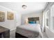 Bedroom with a queen bed, wooden headboard, and window at 930 White St, Atlanta, GA 30310
