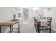 Bright dining room with a table, chairs, and a wooden serving cart at 930 White St, Atlanta, GA 30310