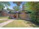 Charming craftsman style home with brick exterior and lush landscaping at 930 White St, Atlanta, GA 30310