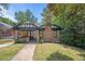 Brick home with a charming front porch and well-manicured lawn at 930 White St, Atlanta, GA 30310