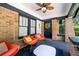 Inviting front porch with brick columns and orange armchairs at 930 White St, Atlanta, GA 30310