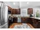 Updated kitchen featuring dark cabinetry and stainless steel appliances at 930 White St, Atlanta, GA 30310