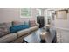 Cozy living room featuring a gray sofa, coffee table, and decorative pillows at 930 White St, Atlanta, GA 30310