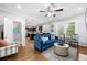 Spacious living room with hardwood floors and a blue sofa at 930 White St, Atlanta, GA 30310