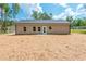 Rear view of a home showing a patio and spacious backyard at 121 Hunters Ln, Powder Springs, GA 30127