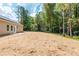 Large, grassy backyard extending into the surrounding trees at 121 Hunters Ln, Powder Springs, GA 30127