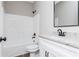 Clean bathroom featuring a white vanity, granite countertop, and white shower-tub combination at 121 Hunters Ln, Powder Springs, GA 30127