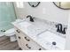 Bathroom showcasing a dual sink vanity with modern fixtures at 121 Hunters Ln, Powder Springs, GA 30127
